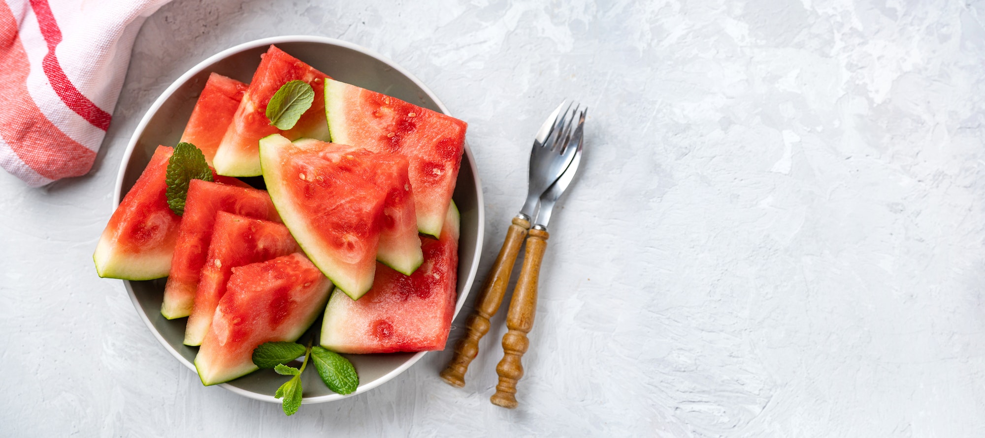 Seedless sliced watermelon on light backrgound