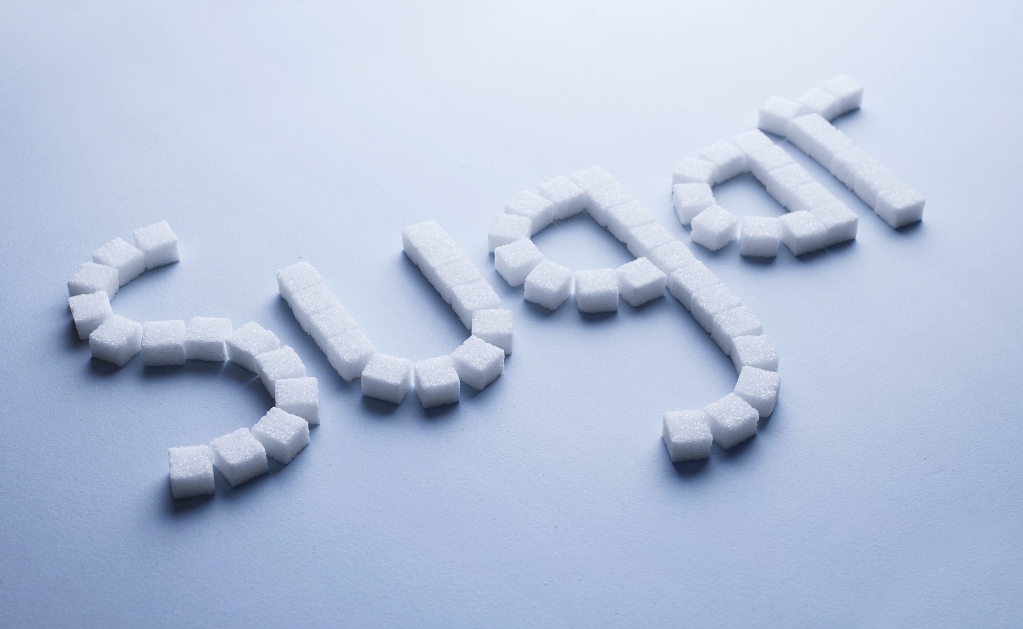 Sugar text made of white sugar cubes